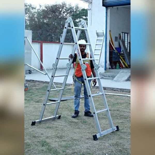ATypeLadder6ft.jpg A man in a safety vest stands beside a ladder, ready to work.